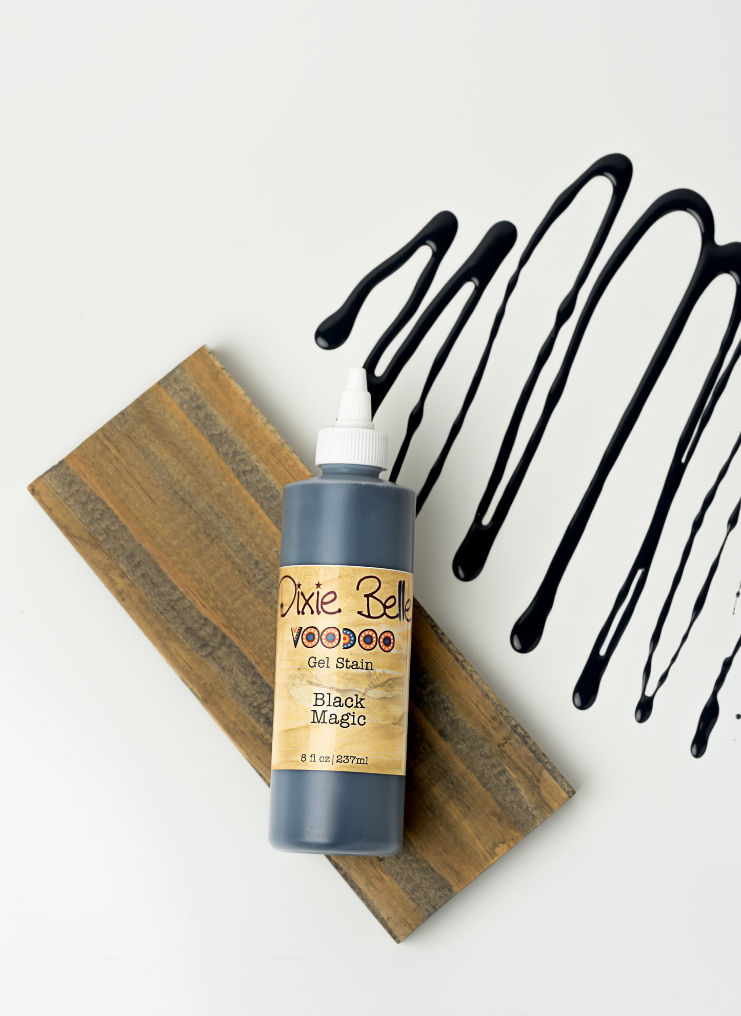 Dixie Belle VooDoo Gel Stain Black Magic – 8 fl oz squeeze bottle with wood swatch and black gel drizzle