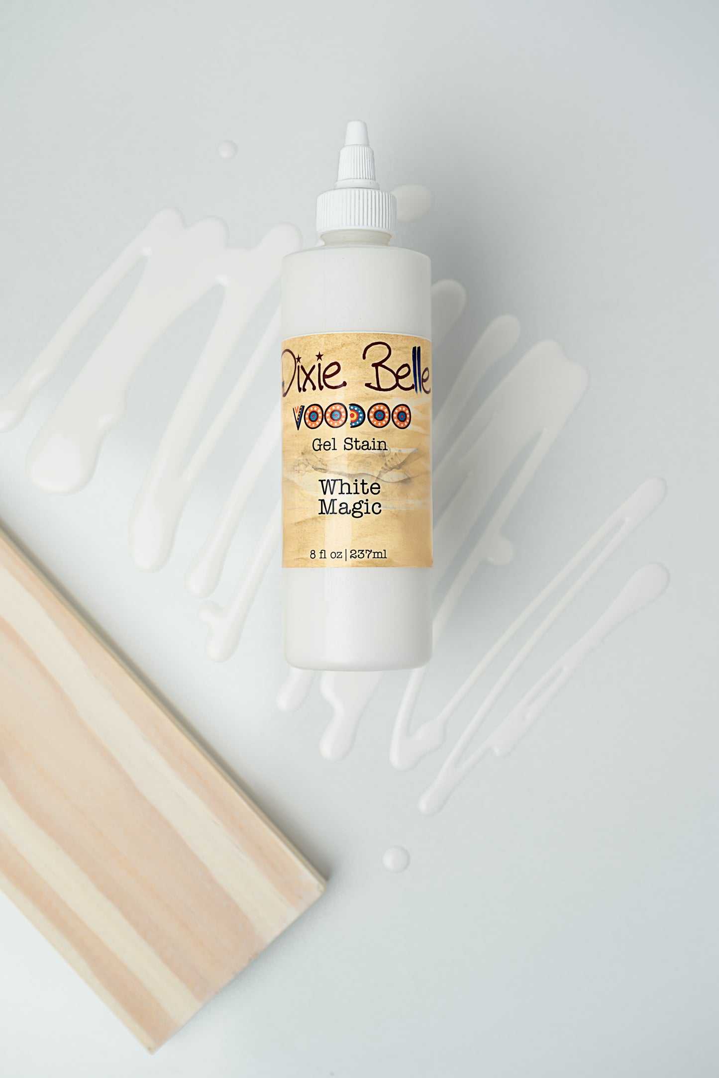 Dixie Belle VooDoo Gel Stain White Magic – 8 fl oz squeeze bottle with white gel swipes on light background
