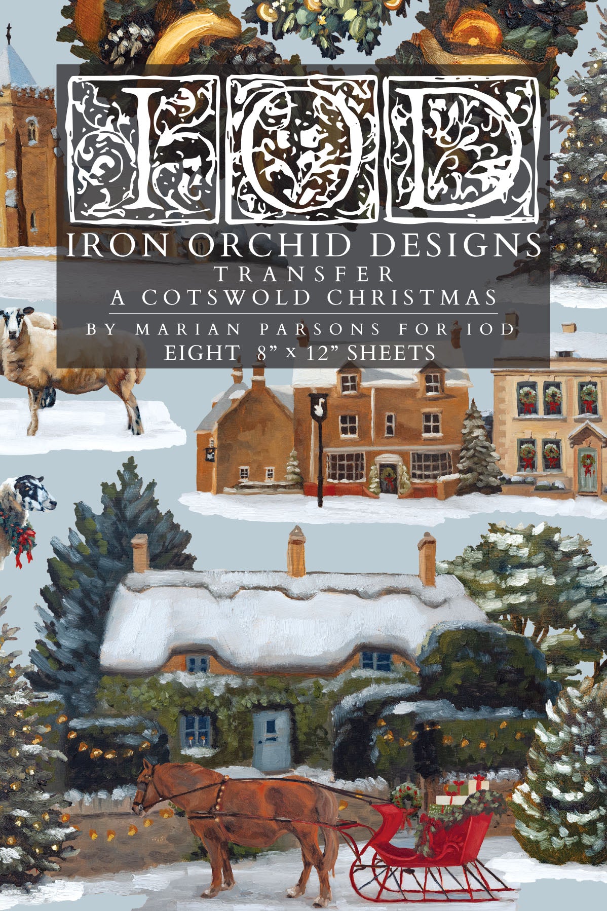 IOD A Cotswold Christmas Transfer front packaging — painterly English winter village scene with thatched cottage, horse-drawn sleigh, and snow-dusted trees by Marian Parsons