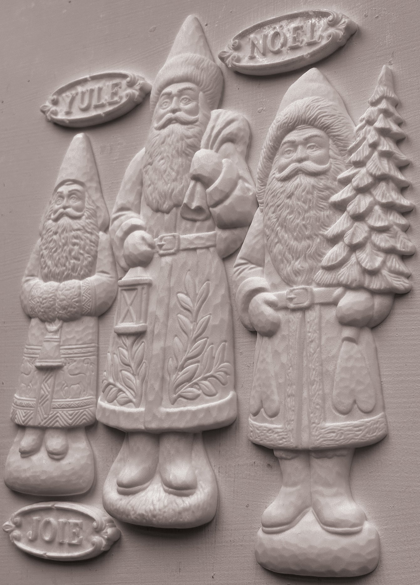 IOD Belsnickel Mould castings – three Belsnickel Santa figures with Yule, Nöel and Joie plaques in white clay