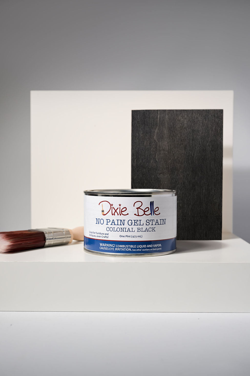 Dixie Belle No Pain Gel Stain Colonial Black one pint can with brush and dark wood sample