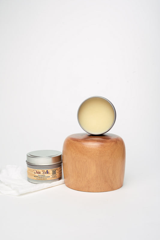 Dixie Belle Pre-Stain Wood Conditioner 4oz tin on wooden surface