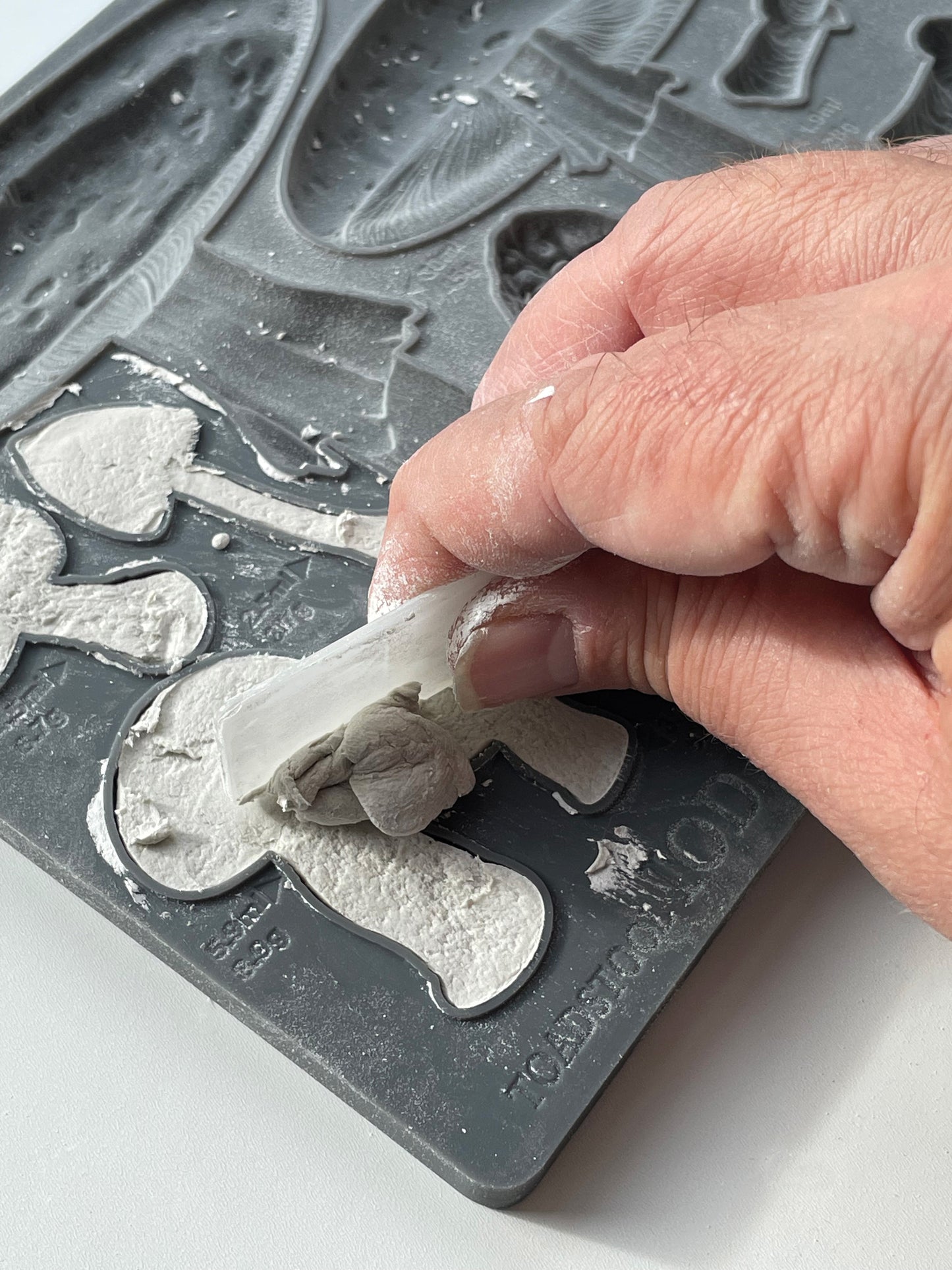 Toadstool IOD Mould – casting being removed from mould